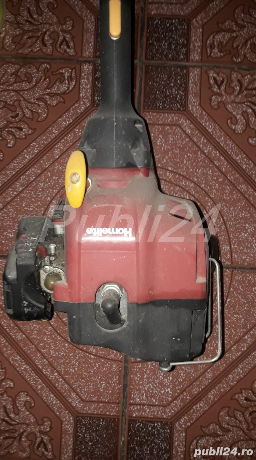 Vand MOTOCOASA cu fir  HOMELITE alimentata cu amestec ulei si benzina,BONUS-ulei si fir