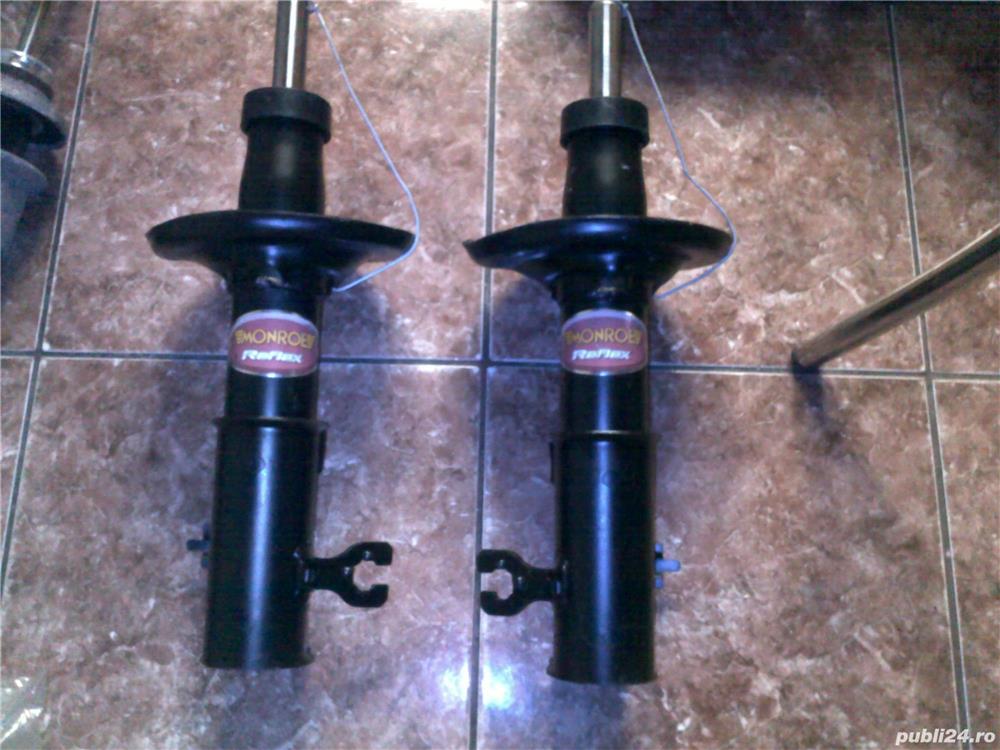 amortizor monroe  fata mazda 323f  nou