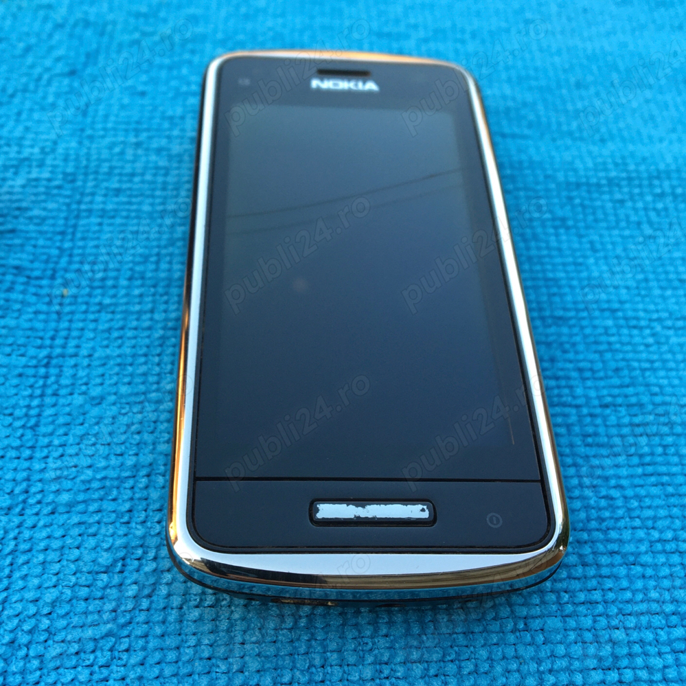 Nokia C6-01 in stare de functionare cu o fisura pe ecran codat orange