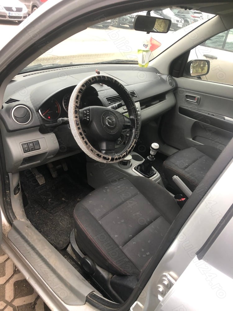 Mazda 2,motor 1.4,începători sau navetă.