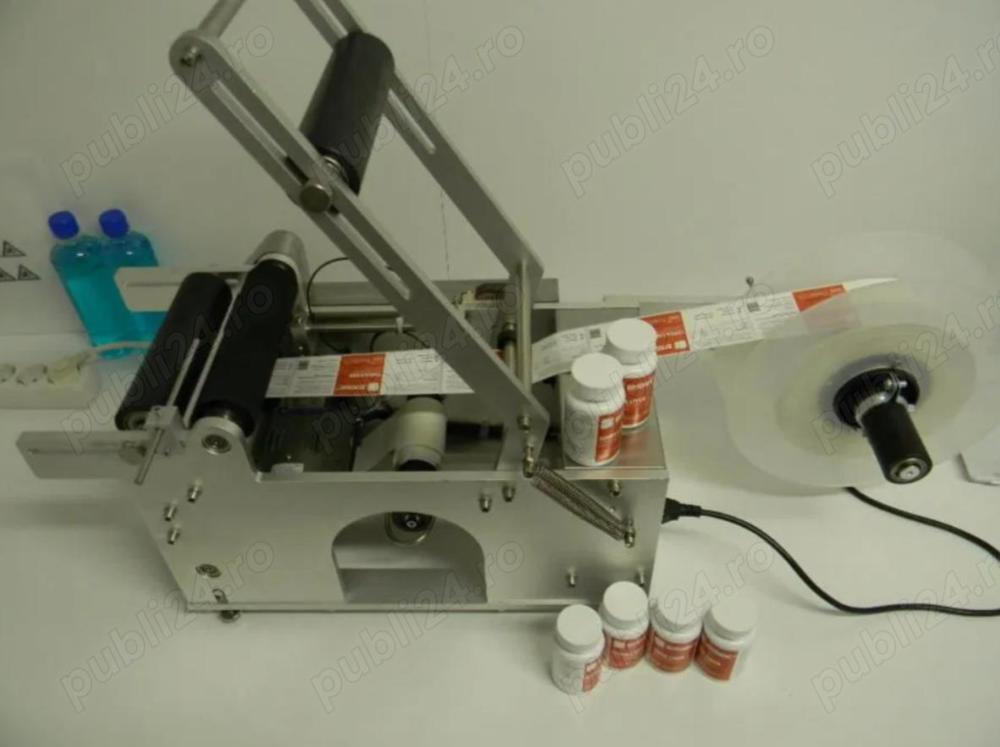 Masina etichetare recipiente cilindrice din plastic