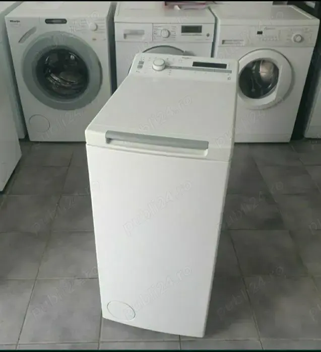 Masina de spălat rufe Whirlpool.  Cu deschidere verticală 