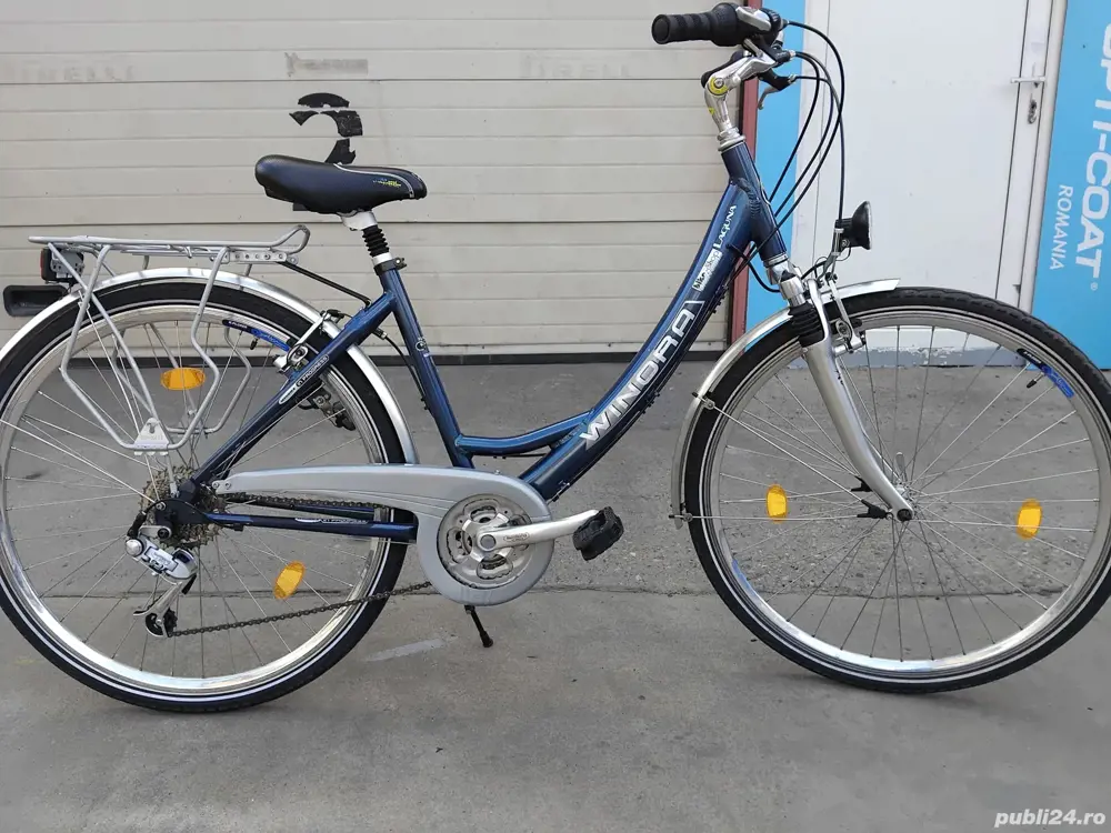 Vând bicicleta din aluminiu pentru damă 