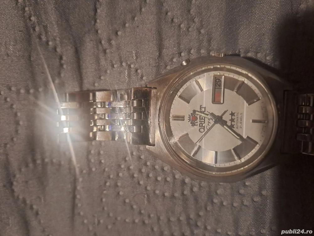 vând ceas ORIENT. automatic.21 cristal 