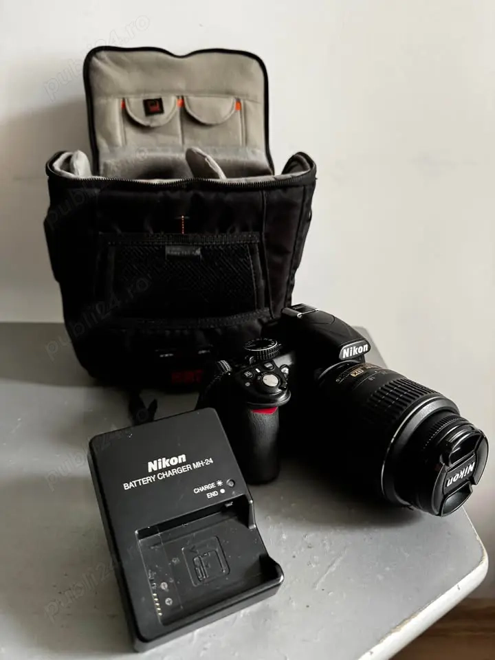 Vand camera foto  nikon d3100 + obiectiv 18-55mm nikon DX Af-S nikkor si geanta 
