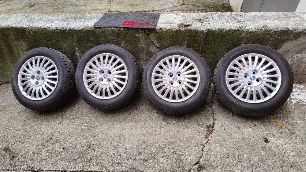 set 4 Roti de iarna pentru fiat cu capace originale 185/65/R15