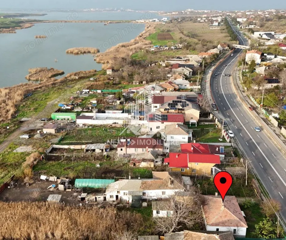 Teren intravilan 1052mp cu casa renovabila de cărămidă Tuzla