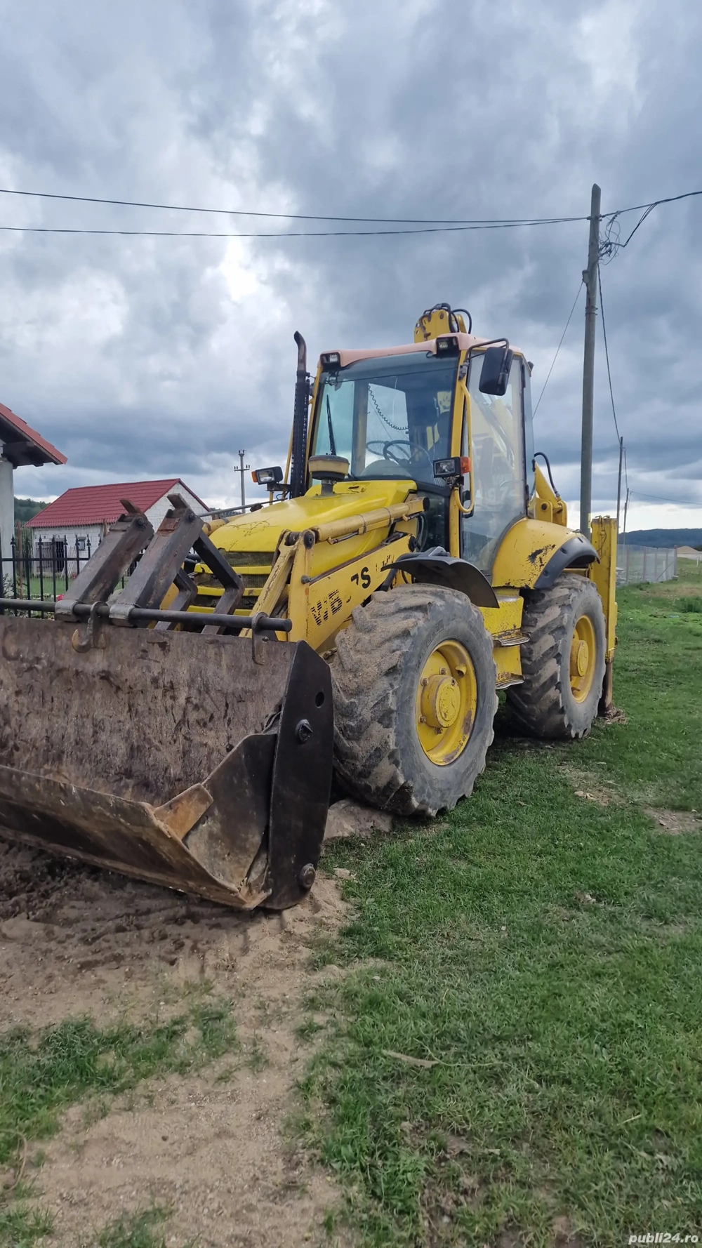 buldoexcavator komatsu wb 97s 