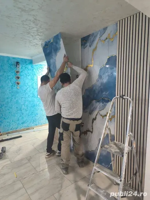 echipa de constructi executam interioare cat si exterioare 