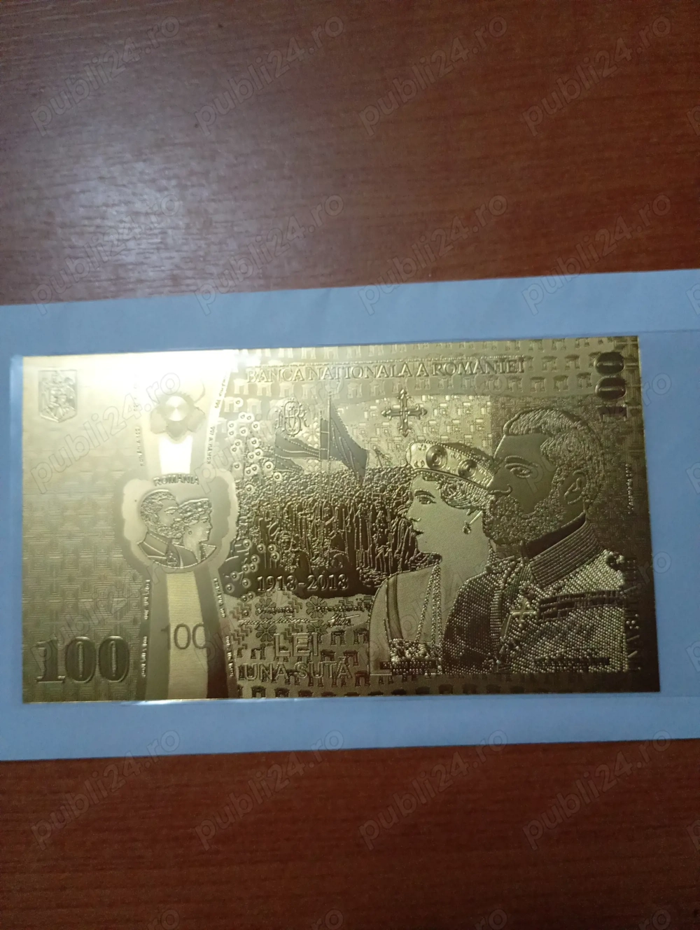 vând bancnotă de 100 de lei din foiță de aur de la Banca Națională a României 