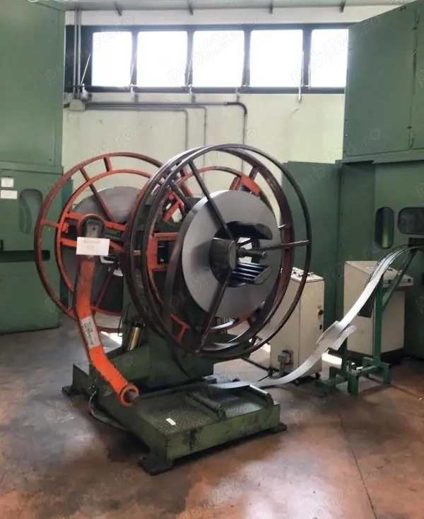 Vând Derulor Înfășurător Dublu (motorizat cu braț de apăsare pe banda) pentru deservirea presei