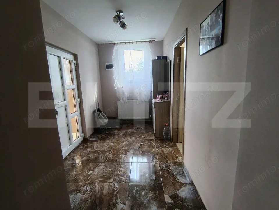 Casa cu 3 camere,baie, bucatarie, teren 500 mp