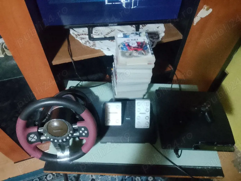 Vand PS3 cu jocuri si volan cu pedale de picior 