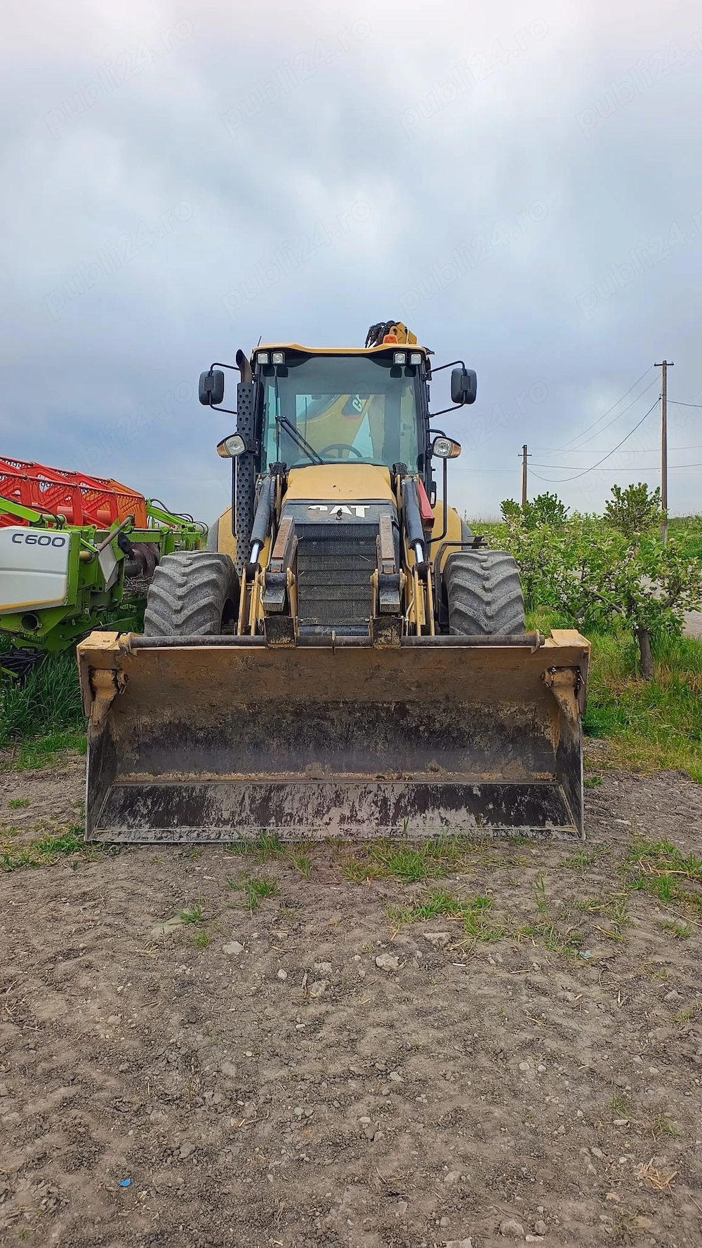 Vand Buldoexcavator CATERPILLAR
