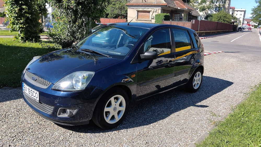 FORD FIESTA 2006 , 1.25 BENZINA, 5 USI,clima,geamuri electrice, computer de bord, roti iarna si vara