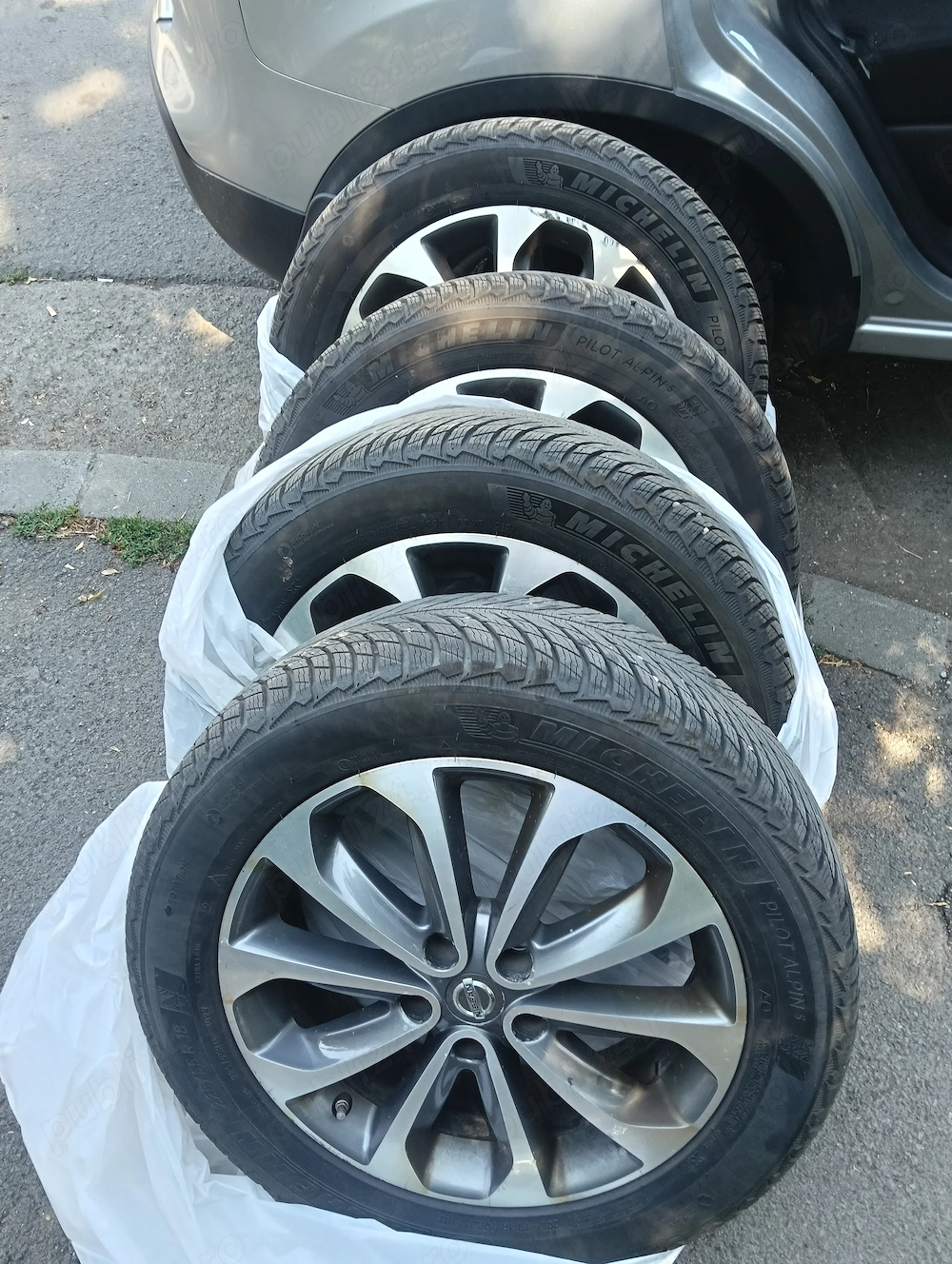 Set complet jante originale Nissan R18 + anvelope de iarnă Michelin Pilot Alpin 5