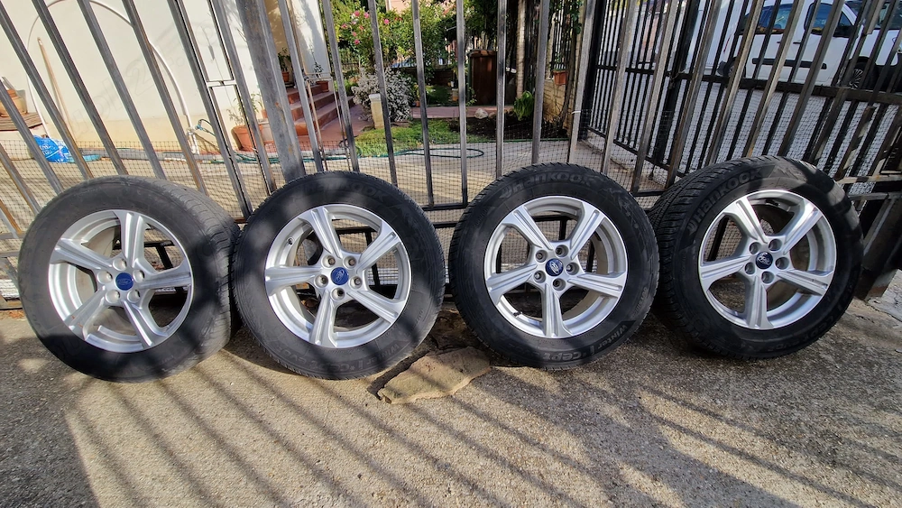 Set 4 Jante originale aliaj Ford Puma+cauciuc iarna Hankook 205/65 R16