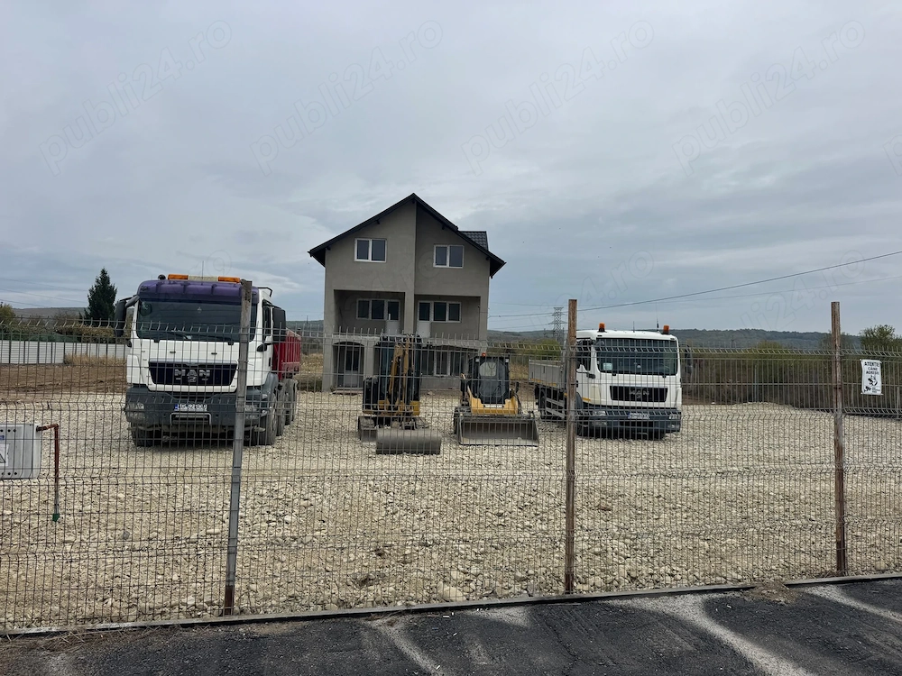 de închiriat -Teren intravilan betonat (12.000 mp ) cu deschidere 52 m la DN73 cu clădire P+2