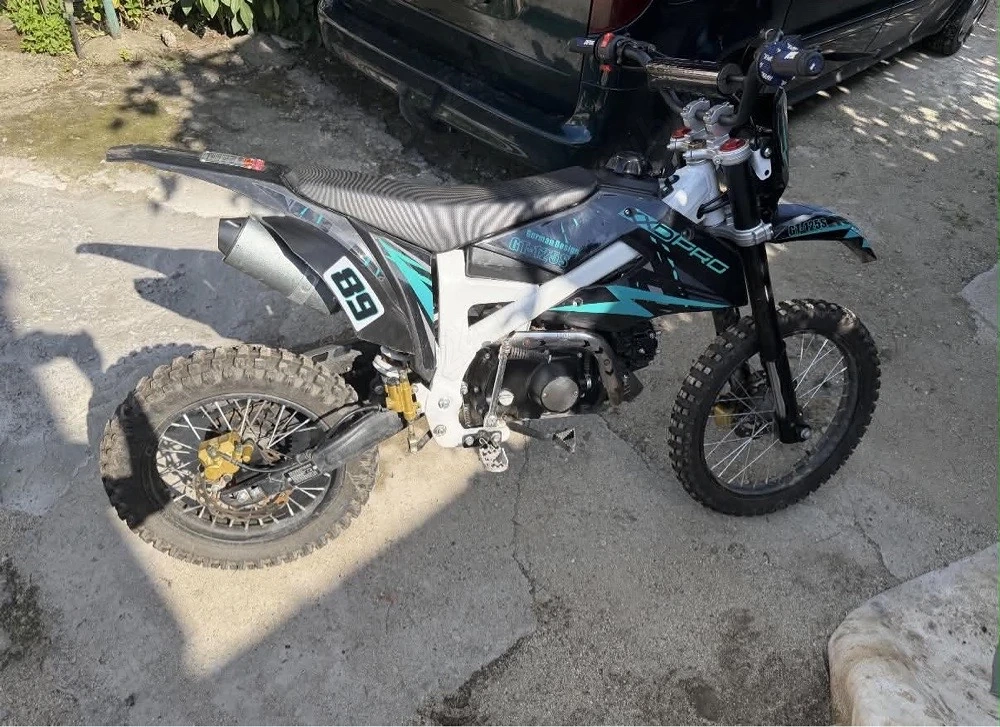 Vand kxd 125cc,4 timpi,foarte putin folosit