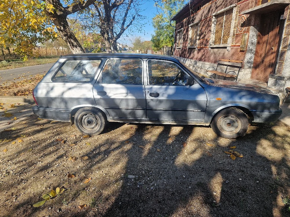 Vând Dacia  break
