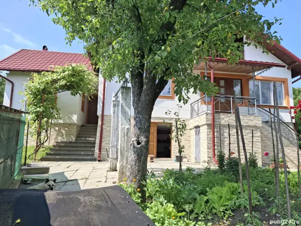 Casa 5 camere, util 122 mp, beci, garaj. 1.200 mp intravilan cu livada