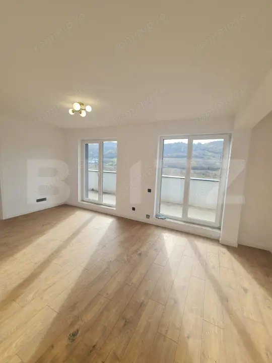 Apartament finisat, 52 mp utili, terasa 34 mp, zona Terra — fotografia 3