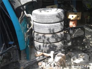 vand anvelope cu janta m&s cu dimensiunile 205/70r15.