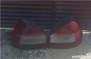 Vand faruri audi a 3 cu instalatie de xenon si stopuri spate