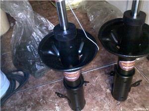 amortizor monroe  fata mazda 323f  nou - imagine 9