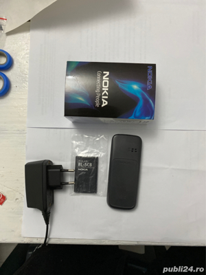 Nokia 100 baterie noua,la cutie impecabil