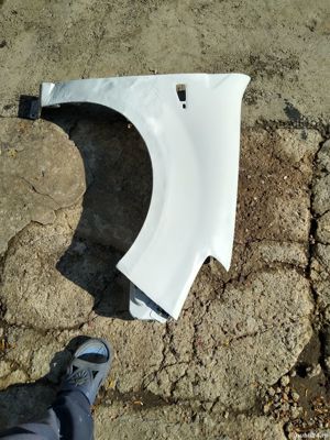 Aripa dreapta fata sandero 2008-2012 alba OCAZIE 89 lei - imagine 2