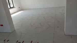 Firma executam montaj faianta si gresie suprafete mari 