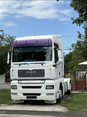 Ansamblu cap-tractor MAN + semi-remorca SCHMITZ