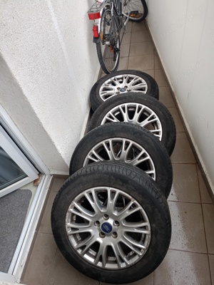 Vând set 4  jante aluminiu ford originale cu cauciucuri de vara Michelin pe 16 ", stare perfecta  - imagine 3