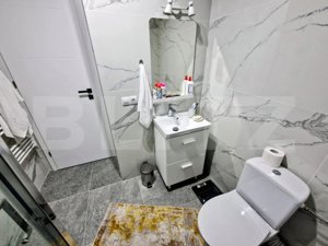 Apartament modern, 3 camere, 2 bai, garaj, zona centrala Floresti ! - imagine 9