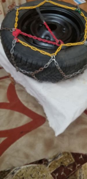 Vand  2 roti Dacia 1310 cu cauciucuri  iarna vara cu lanturi.