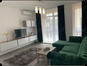 Ofer spre închiriere apartament modern mobilat și utilat, loc de parcare inclus