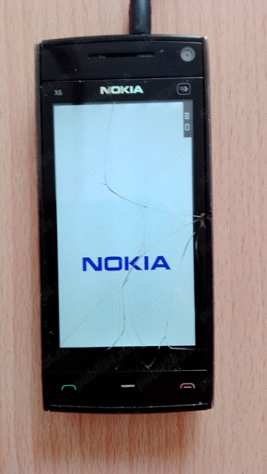 Telefon mobil Nokia X6 cu încărcător