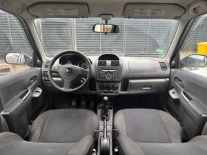 Subaru Justy 4x4    1.3 benzină   2006 - imagine 9