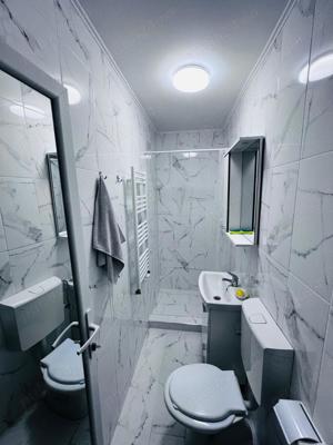 Inchiriem apartament cu 2 camere Micro 19 parter cu gradina( Neacsu), pret 1500 lei - imagine 9