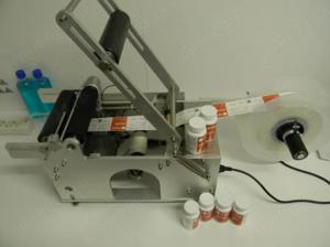 Masina etichetare recipiente cilindrice