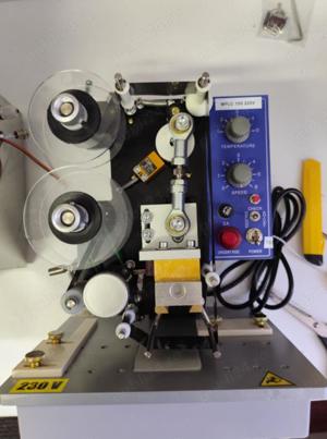 Masina pentru tiparirea datelor pe materiale plate