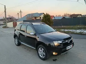 Dacia Duster 1.5 dCi Laureate 110 Cp euro 5,4WD,AC,geamuri el.,jenti aliaj,volan piele - imagine 8 Dacia Duster 1.5 dCi Laureate 110 Cp euro 5,4WD,AC,geamuri el.,jenti aliaj,volan piele - imagine 8
