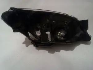 Faruri originale pe fond negru Opel Astra H - HELLA(2004-2014) - imagine 6