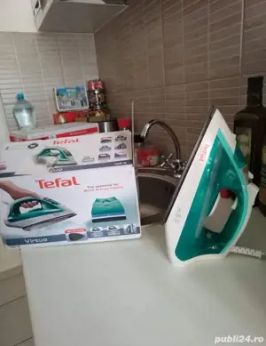 Vând fier de călcat Tefal, talpă de ceramica,urme de folosire.