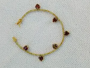 Vand bratara tennis aur galben 14k cu diamante și granate