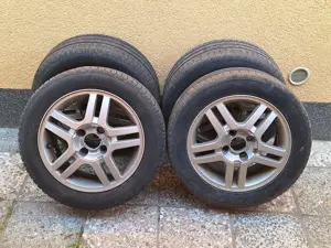 Vand  4 jenti aluminiu R15 cu 4 prezoane Ford Focus 1