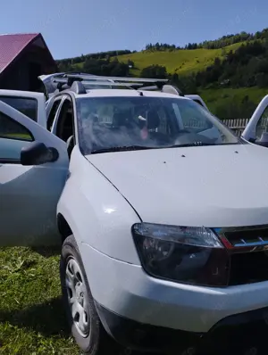 Vând Dacia Duster in stare foarte bună 4*4 diesel..an 2013 - imagine 4