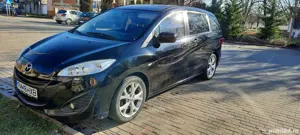 Vand mașina noastră  de familie Mazda 5 ,7 locuri ,cui remorca ,6 viteze pilot automat,etc  