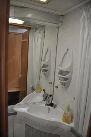 Rulota Knaus Sudwind 6704 - sistem fotovoltaic - imagine 6